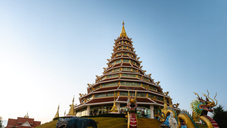 The grand white dragon staircase at Wat Huay Pla Klang, a top attraction featured in this Chiang Rai travel guide