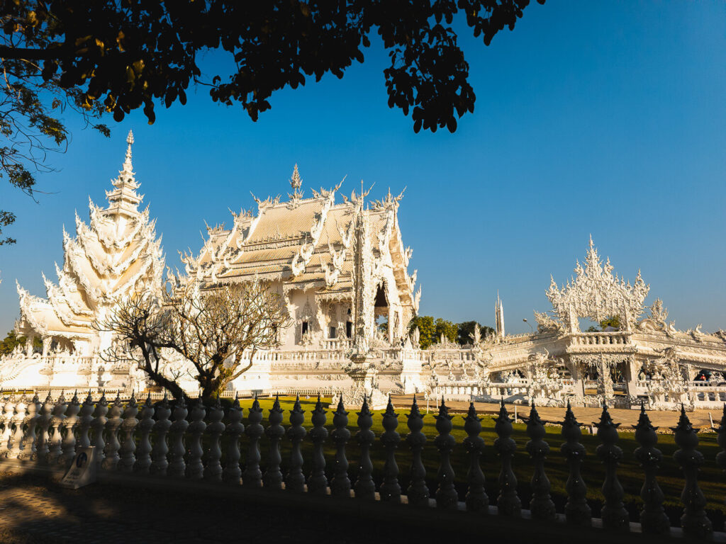 White Temple vs Blue Temple comparison featuring Wat Rong Khun exterior in Chiang Rai