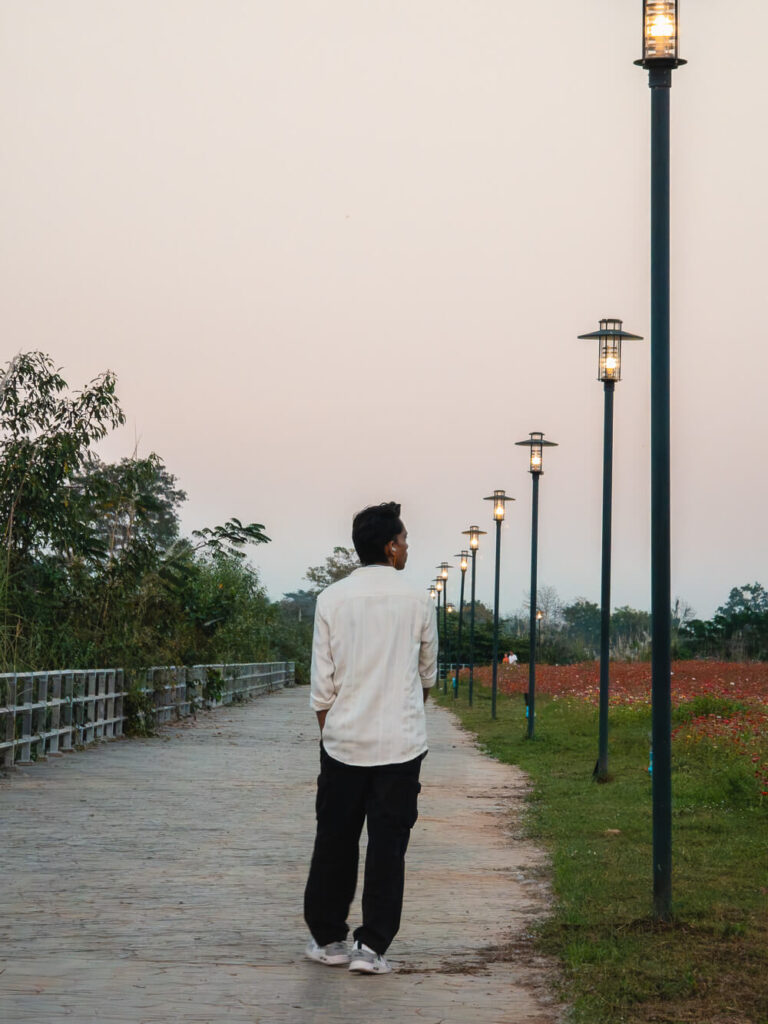 The author walking through a street in the City of Chiang Rai, Thailand.