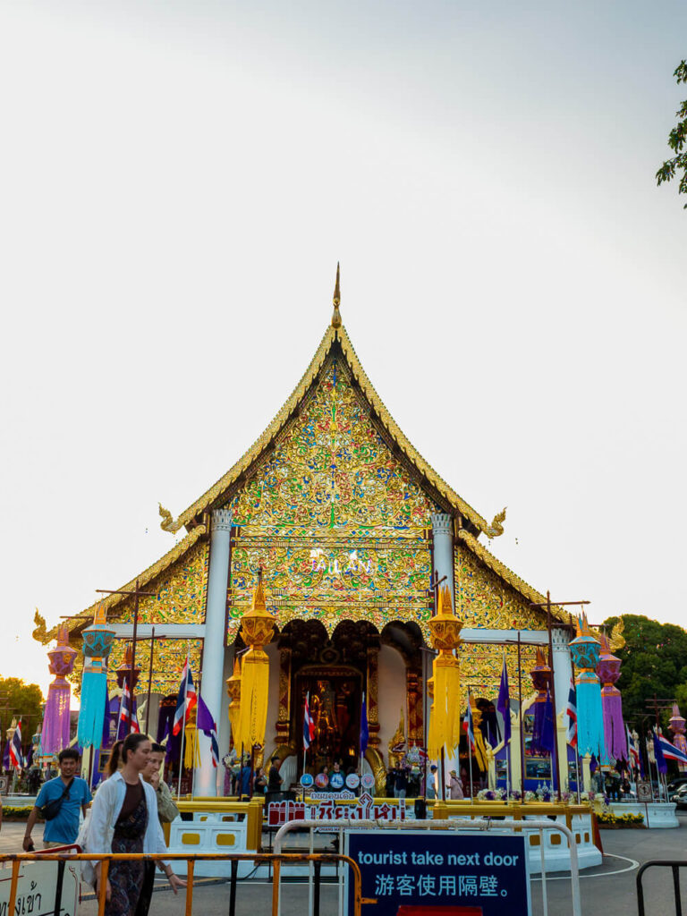 The intricate gold facade of Wat Phra Singh temple in Chiang Mai.