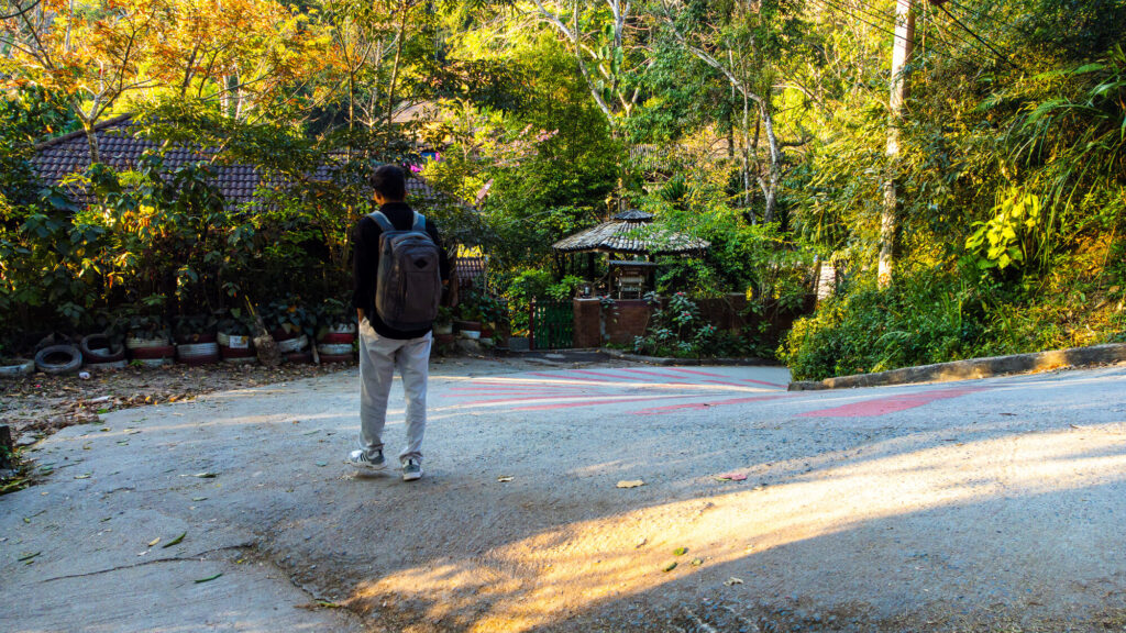 Author walking through Mae Kampong village during a Chiang Mai budget travel guide trip.
