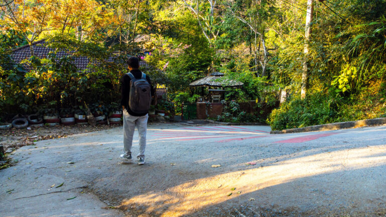 Author walking through Mae Kampong village during a Chiang Mai budget travel guide trip.