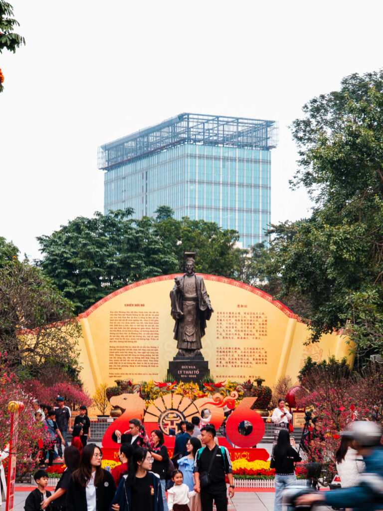 Daylight shot of the Chieu Doi Do statue surrounded by a well maintained green garden near Hoan Kiem Lake.