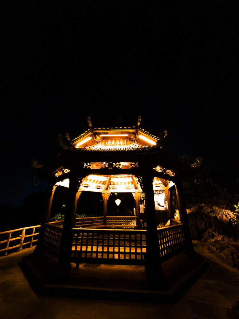 A quiet lit up waiting area near Thap Tu An temple during the night in Ninh Binh.