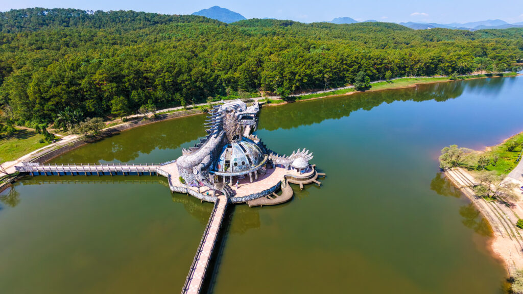 Drone shot of the overgrown lake and the giant dragon structure at Ho Thuy Tien in central Vietnam