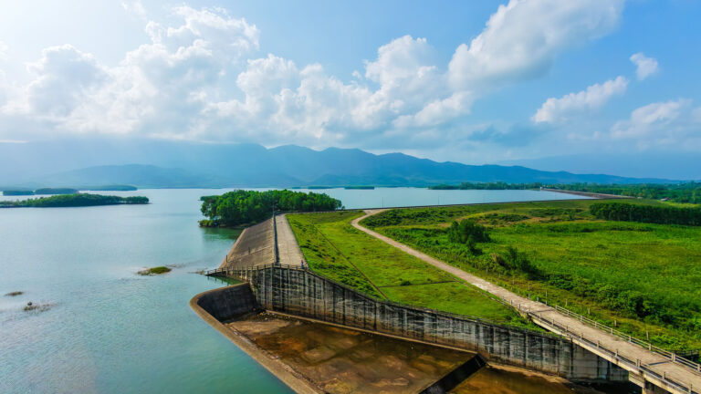 Aerial drone view of the peaceful Khu Du Lich Sinh Thai Khe Tan reservoir, one of the best hidden places in Hoi An to escape the tourist crowds.