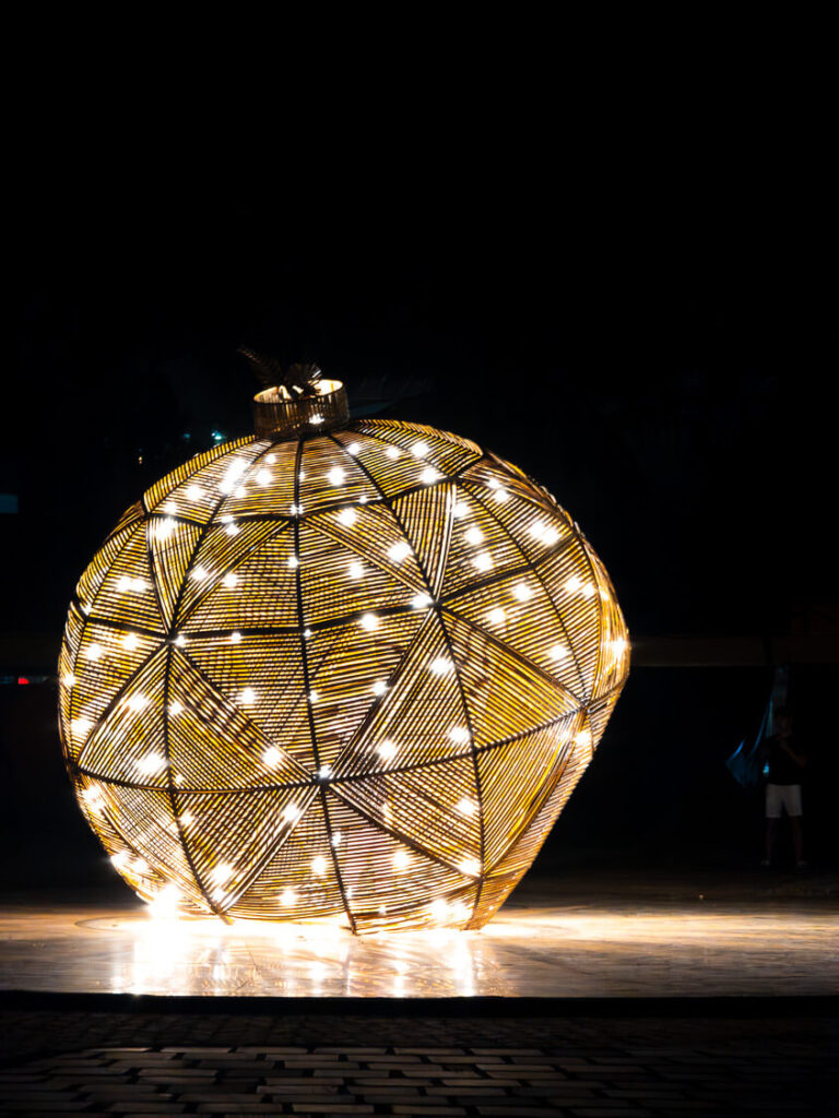 Glowing traditional silk lanterns illuminating the historic streets and architecture of Hoi An Ancient Town at night.