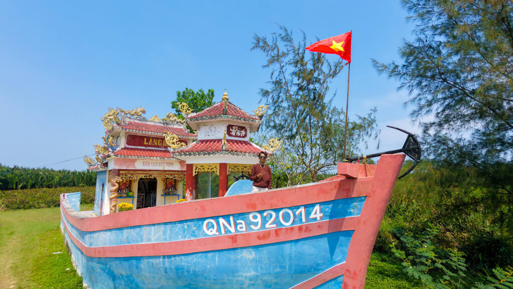 Standing inside a modest, incense-filled boat temple on Cam Kim Island, a local shrine built for Vietnamese fishing families.