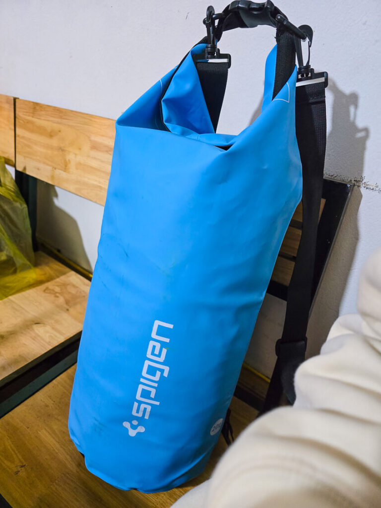 A sealed waterproof travel dry bag used for washing clothes by hand while backpacking.