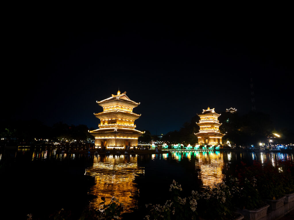Vietnam Entry Rules 2026 featuring the illuminated twin towers of Tháp Tứ Ân in Ninh Bình, Vietnam