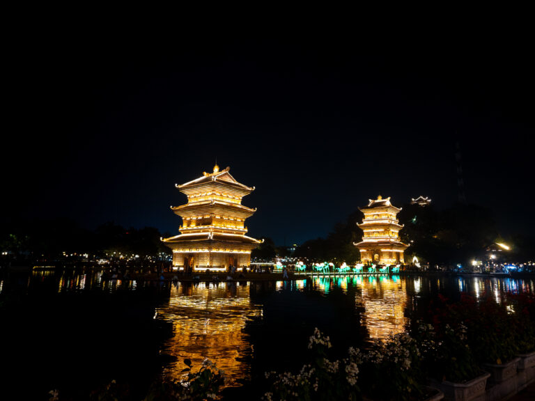 Vietnam Entry Rules 2026 featuring the illuminated twin towers of Tháp Tứ Ân in Ninh Bình, Vietnam